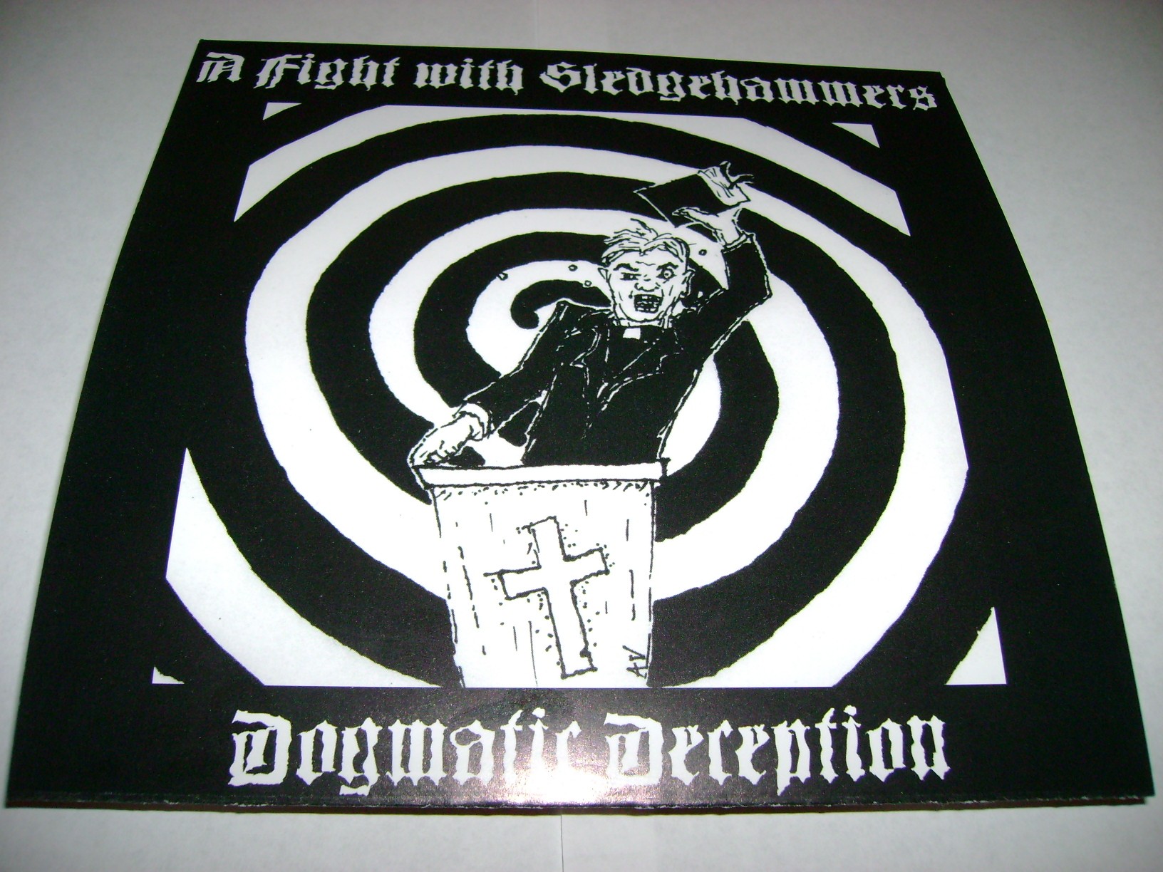 A FIGHT WITH SLEDGEHAMMERS - Dogmatic Deception 7"